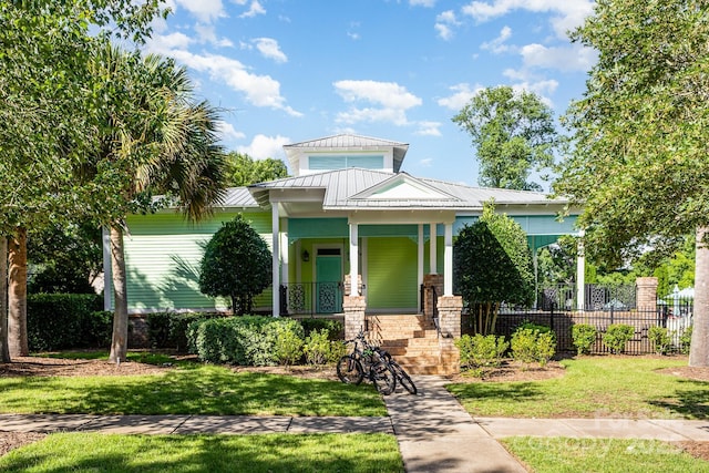 9210 Ginhouse Ln, Charlotte, NC 28277 - view of front facade featuring a porch and a metal roof