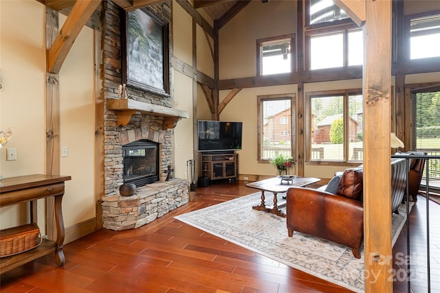 649 Panoramic Loop, Maggie Valley, NC 28751 - living area featuring high vaulted ceiling, a fireplace, wood finished floors, baseboards, and beamed ceiling