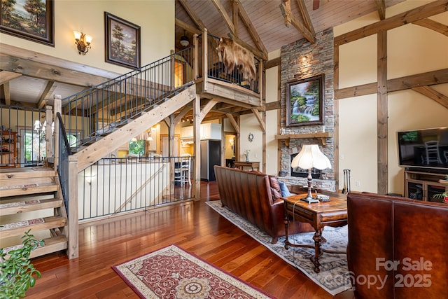 649 Panoramic Loop, Maggie Valley, NC 28751 - living room featuring high vaulted ceiling, hardwood / wood-style flooring, wood ceiling with exposed beams, stairs, and a fireplace
