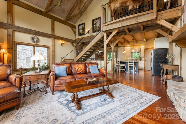 649 Panoramic Loop, Maggie Valley, NC 28751 - living room with high vaulted ceiling, stairs, wood-type flooring, and wooden ceiling with exposed beams