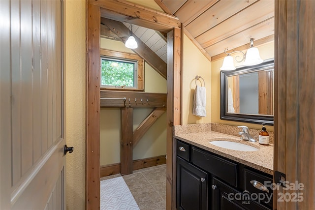 649 Panoramic Loop, Maggie Valley, NC 28751 - bathroom with vanity, lofted ceiling, and tile patterned flooring