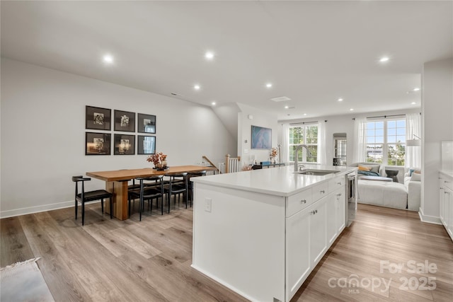 120 August Ln, Stallings, NC 28104 - kitchen with a sink, open floor plan, recessed lighting, white cabinets, and a kitchen island with sink