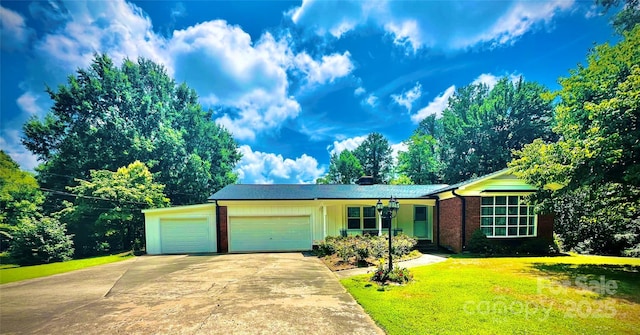2405 Forrestbrook Dr, Kannapolis, NC 28083 - view of front of property featuring a garage, a front yard, driveway, and brick siding
