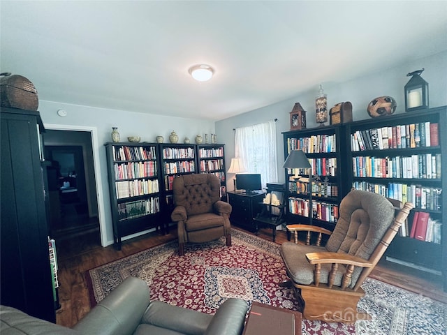 2405 Forrestbrook Dr, Kannapolis, NC 28083 - sitting room featuring wood finished floors and bookshelves