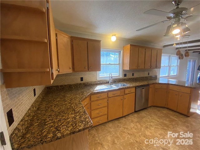 2405 Forrestbrook Dr, Kannapolis, NC 28083 - kitchen featuring stainless steel dishwasher, a sink, backsplash, ceiling fan, and a textured ceiling