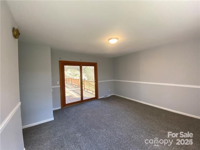 2405 Forrestbrook Dr, Kannapolis, NC 28083 - empty room featuring dark colored carpet and baseboards