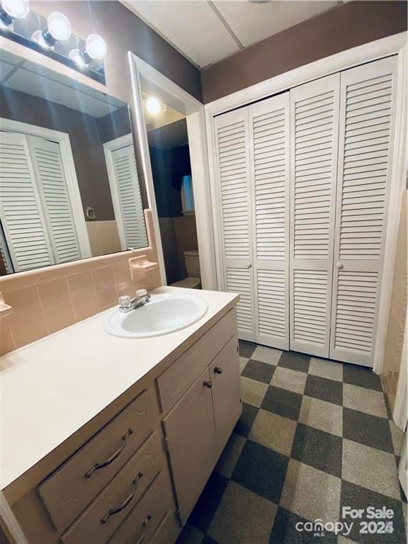 2405 Forrestbrook Dr, Kannapolis, NC 28083 - bathroom featuring a closet, toilet, tile patterned floors, and vanity