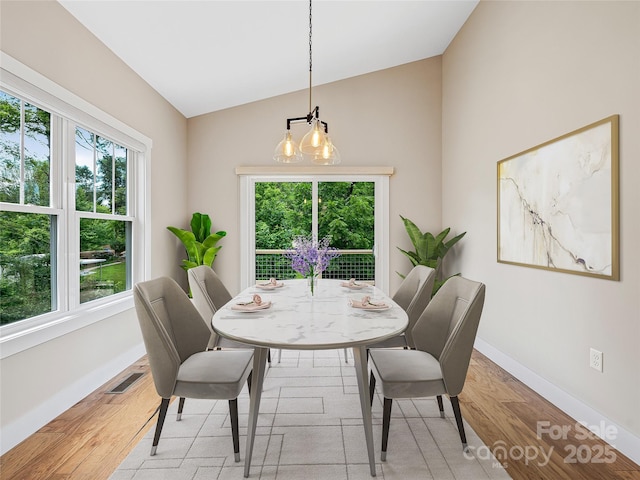 108 Le-An-Hurst Rd, Asheville, NC 28803 - dining space with light wood-style floors and high vaulted ceiling