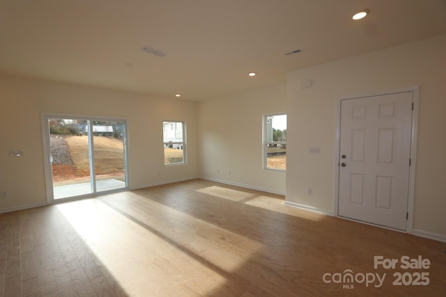222 Harpers Run Ln, Matthews, NC 28104 - empty room featuring light wood-style floors, recessed lighting, and baseboards