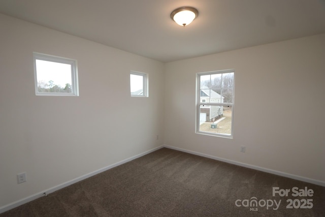 222 Harpers Run Ln, Matthews, NC 28104 - empty room featuring dark colored carpet and baseboards