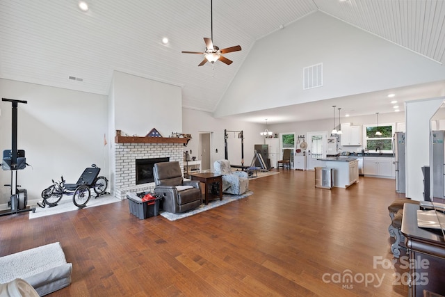 771 Sally Gap Rd, Old Fort, NC 28762 - living room with ceiling fan, high vaulted ceiling, wood finished floors, a brick fireplace, and recessed lighting