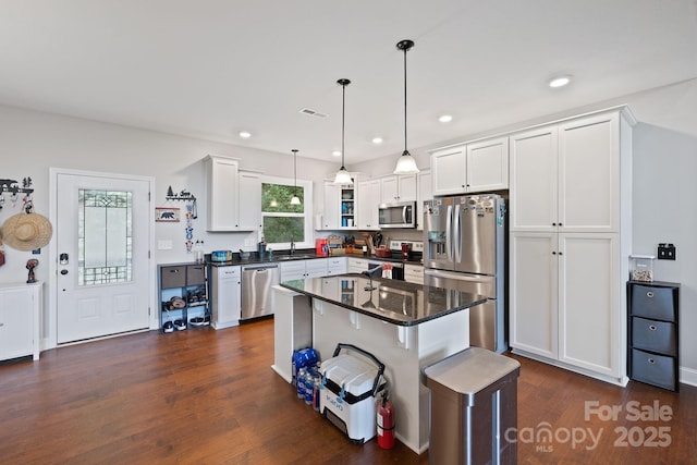 771 Sally Gap Rd, Old Fort, NC 28762 - kitchen featuring appliances with stainless steel finishes, white cabinetry, dark wood-style floors, decorative light fixtures, and recessed lighting