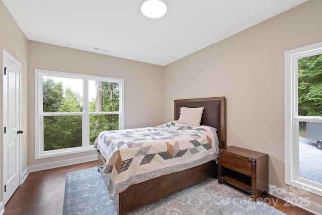 771 Sally Gap Rd, Old Fort, NC 28762 - bedroom with multiple windows and wood finished floors