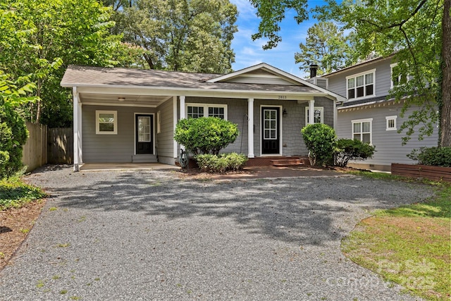 2813 Hilliard Dr, Charlotte, NC 28205 - view of front of property with gravel driveway, an attached carport, and a shingled roof
