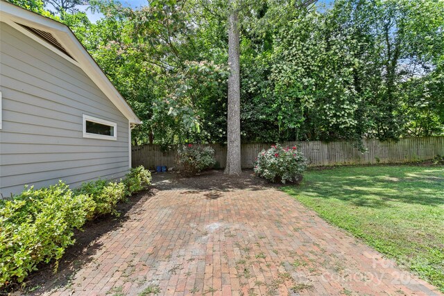 2813 Hilliard Dr, Charlotte, NC 28205 - fenced backyard featuring a patio area
