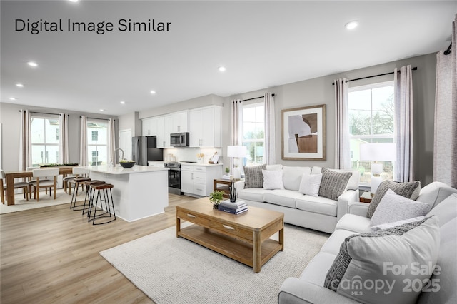 2540 Ellen Ave Unit 1002B, Charlotte, NC 28208 - living area with plenty of natural light, light wood-style floors, and recessed lighting