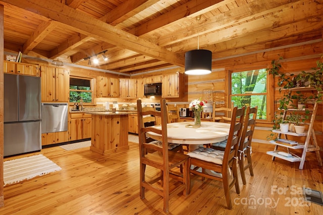 2255 Wolf Laurel Rd, Mars Hill, NC 28754 - dining area featuring wooden ceiling with exposed beams, light wood-style flooring, and wooden walls