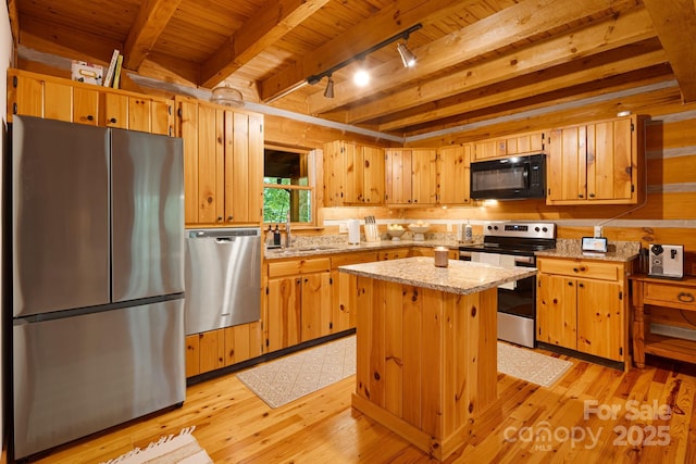 2255 Wolf Laurel Rd, Mars Hill, NC 28754 - kitchen with appliances with stainless steel finishes, light wood-style floors, track lighting, wooden ceiling with exposed beams, and a kitchen island