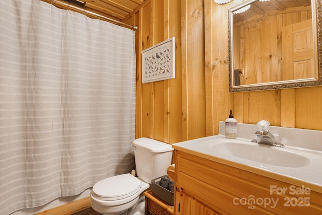 2255 Wolf Laurel Rd, Mars Hill, NC 28754 - bathroom with toilet, vanity, a shower with curtain, and wood walls
