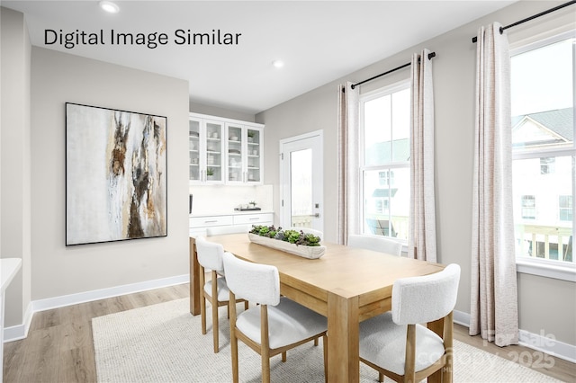 2536 Ellen Ave Unit 1002A, Charlotte, NC 28208 - dining area with light wood finished floors, baseboards, and recessed lighting