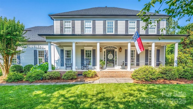 19625 Callaway Hills Ln, Davidson, NC 28036 - colonial-style house featuring a porch, a front lawn, and a shingled roof