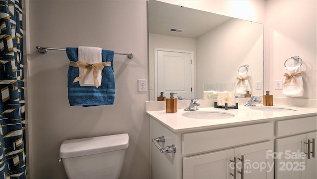111 Eleanor Cove Rd, Arden, NC 28704 - bathroom featuring double vanity and toilet