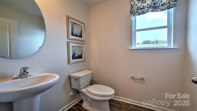 111 Eleanor Cove Rd, Arden, NC 28704 - bathroom featuring baseboards, toilet, wood finished floors, and a sink
