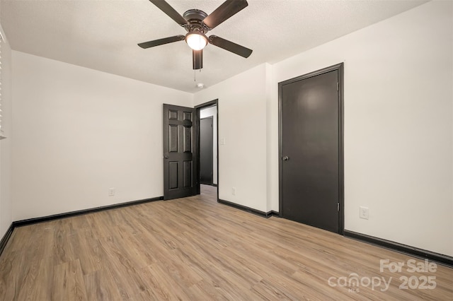 1214 Northwoods Dr, Kings Mountain, NC 28086 - unfurnished bedroom featuring light wood-style flooring, baseboards, and ceiling fan
