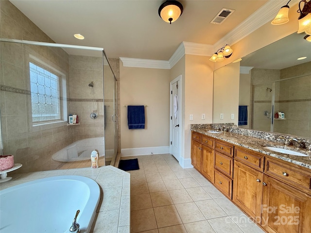 8620 Rolling Fields Rd, Charlotte, NC 28227 - full bath featuring a stall shower, double vanity, a garden tub, tile patterned floors, and crown molding