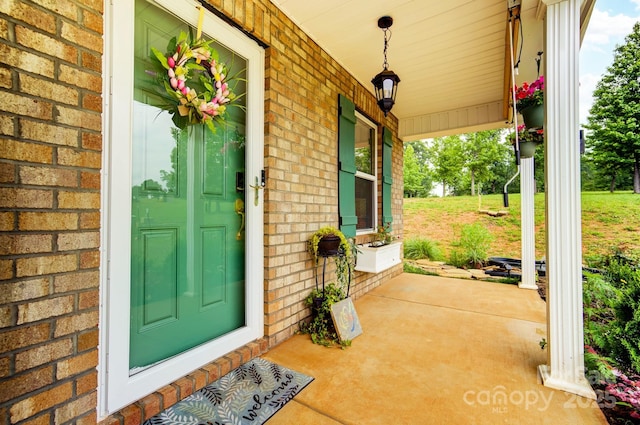 124 Vintage Woods Ct, Shelby, NC 28150 - doorway to property featuring covered porch and brick siding