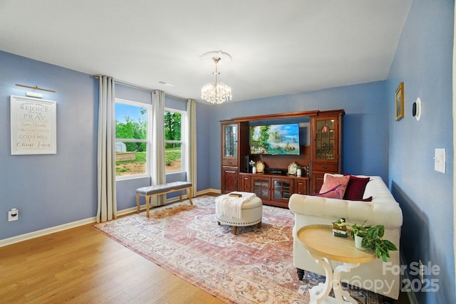 124 Vintage Woods Ct, Shelby, NC 28150 - living area with wood finished floors and a chandelier