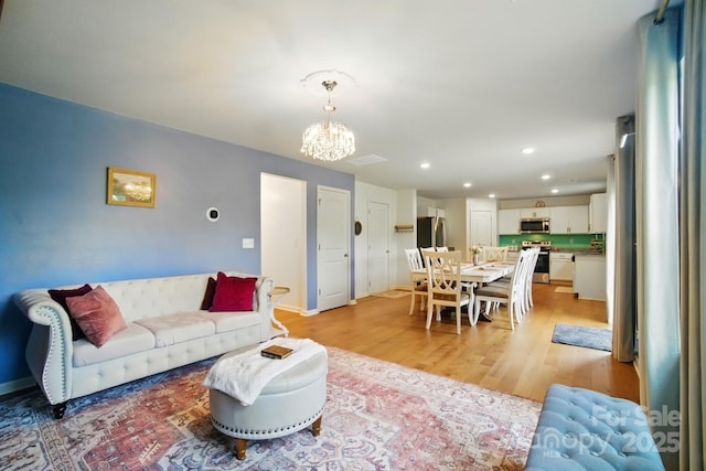 124 Vintage Woods Ct, Shelby, NC 28150 - living area with light wood-style flooring, a chandelier, and recessed lighting