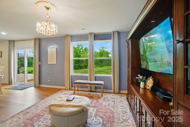 124 Vintage Woods Ct, Shelby, NC 28150 - sitting room with wood finished floors and a chandelier