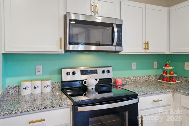 124 Vintage Woods Ct, Shelby, NC 28150 - kitchen featuring appliances with stainless steel finishes, white cabinetry, and light stone countertops