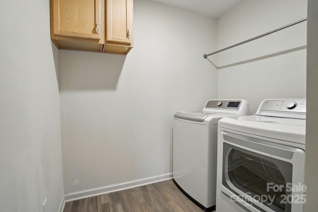 124 Vintage Woods Ct, Shelby, NC 28150 - laundry area with washing machine and clothes dryer, dark wood-type flooring, and cabinet space