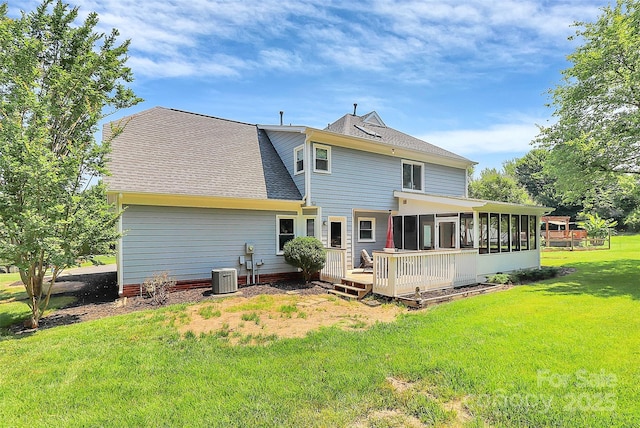 1011 Bydeford Ct, Matthews, NC 28105 - rear view of house featuring a sunroom, a shingled roof, a yard, cooling unit, and a wooden deck