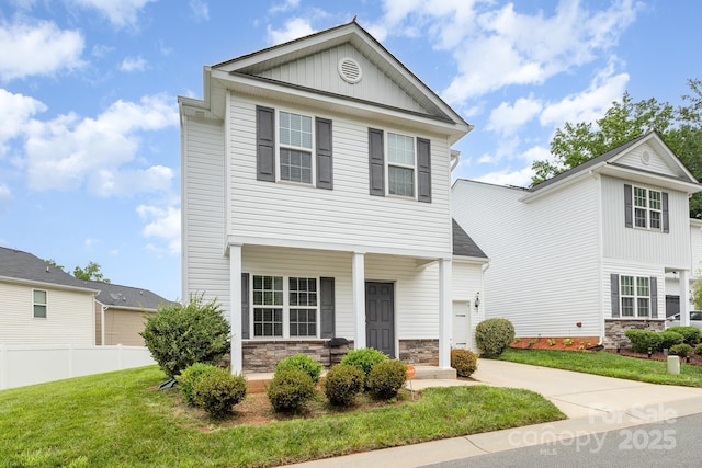 8005 Stevie Oaks Ln, Charlotte, NC 28215 - view of front facade with stone siding, board and batten siding, covered porch, and driveway