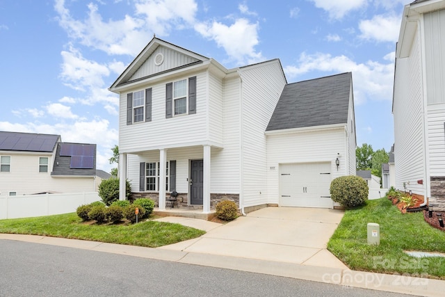 8005 Stevie Oaks Ln, Charlotte, NC 28215 - view of front of home featuring a porch, stone siding, an attached garage, driveway, and board and batten siding