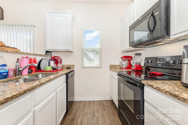 8005 Stevie Oaks Ln, Charlotte, NC 28215 - kitchen featuring black appliances, wood finished floors, white cabinets, and light stone counters