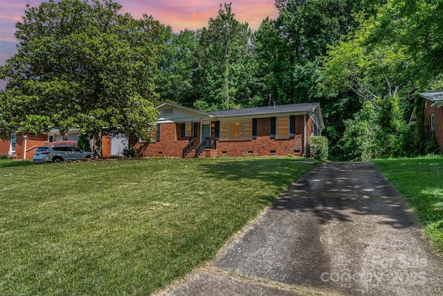 3939 Sheffield Dr, Charlotte, NC 28205 - ranch-style home featuring crawl space, asphalt driveway, a front lawn, and brick siding