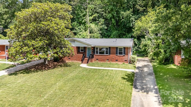 3939 Sheffield Dr, Charlotte, NC 28205 - view of front of house featuring crawl space, brick siding, a front lawn, and driveway