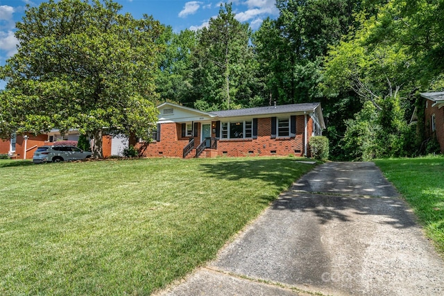 3939 Sheffield Dr, Charlotte, NC 28205 - ranch-style house with crawl space, asphalt driveway, a front lawn, and brick siding