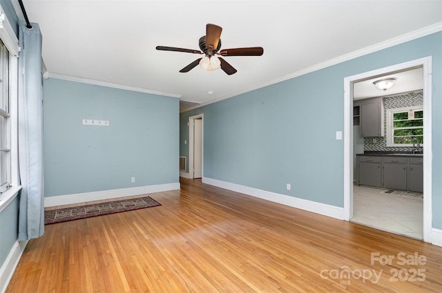 3939 Sheffield Dr, Charlotte, NC 28205 - unfurnished room with ceiling fan, crown molding, and light wood finished floors