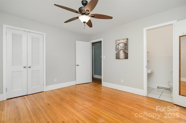 3939 Sheffield Dr, Charlotte, NC 28205 - unfurnished bedroom featuring light wood-style floors, a closet, ensuite bathroom, and ceiling fan