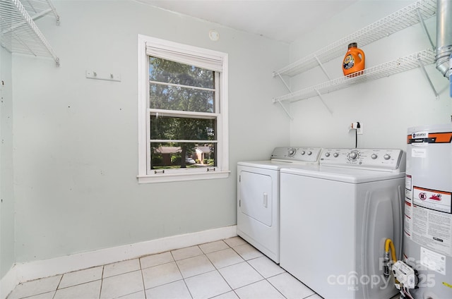3939 Sheffield Dr, Charlotte, NC 28205 - washroom with water heater, washer and dryer, and light tile patterned floors