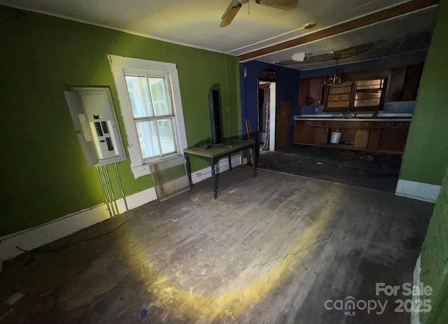 15 Vine St, Canton, NC 28716 - unfurnished living room with wood finished floors, baseboards, cooling unit, a sink, and a ceiling fan