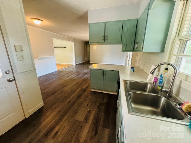 316 Meadowood Cir, Kannapolis, NC 28081 - kitchen featuring green cabinetry, a sink, dark wood finished floors, a textured ceiling, and light countertops