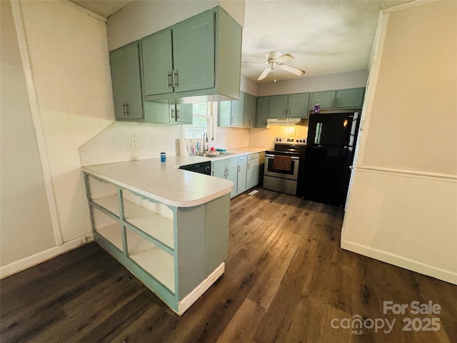 316 Meadowood Cir, Kannapolis, NC 28081 - kitchen featuring stainless steel electric range, freestanding refrigerator, green cabinets, a peninsula, and a ceiling fan