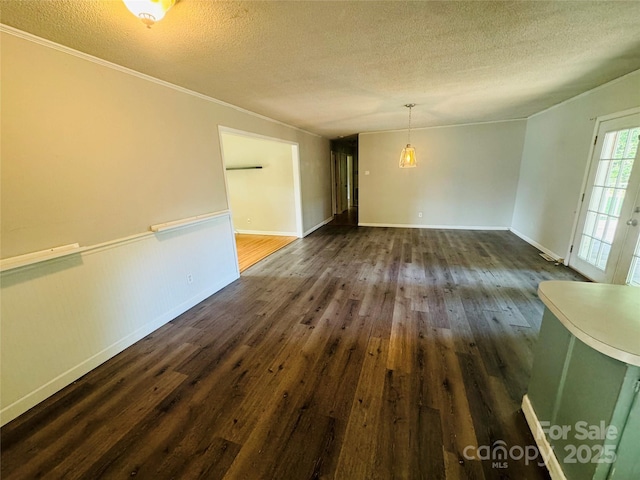 316 Meadowood Cir, Kannapolis, NC 28081 - spare room with a textured ceiling, dark wood-type flooring, baseboards, and crown molding