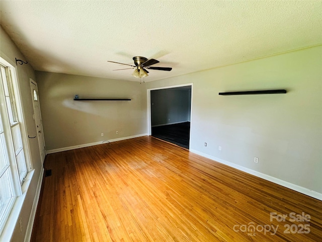 316 Meadowood Cir, Kannapolis, NC 28081 - empty room with ceiling fan, wood-type flooring, a textured ceiling, and baseboards